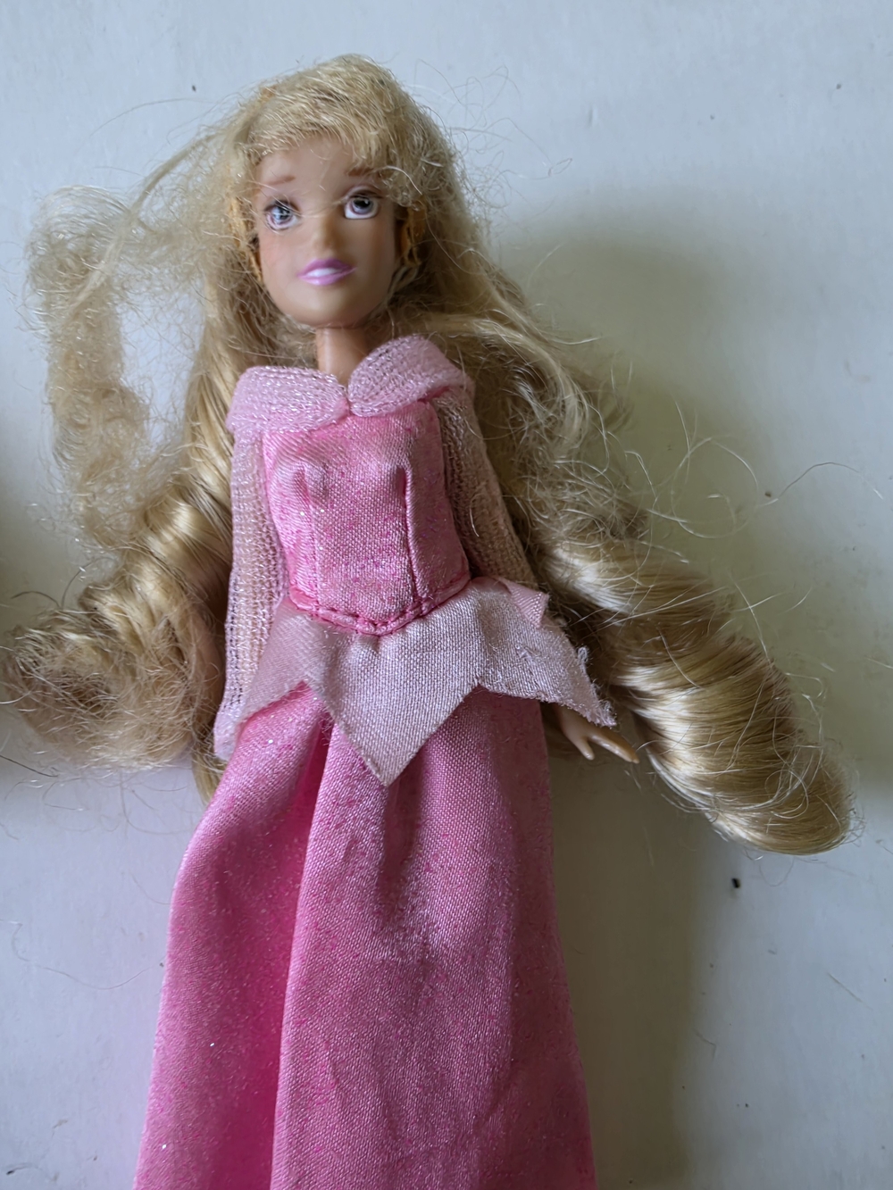 a 5.5-inch Disney Store / Disney Parks Princess collection Aurora mini doll,